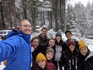 Group of fellows among snowy trees